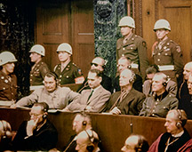 A rare color photo from the Nuremberg Trials, showing men under Jim's command, guarding some of the Nazi's top leaders.